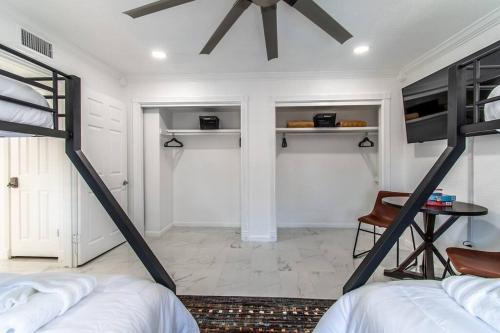 a bedroom with two bunk beds and a desk at Ocean Drive Splendor Awaits in Corpus Christi