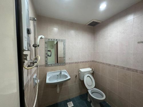 a bathroom with a toilet and a sink at Desa Tebrau 1 Near IKEA Toppen PeiKin Long Sing HeLiXuan Restaurant in Johor Bahru