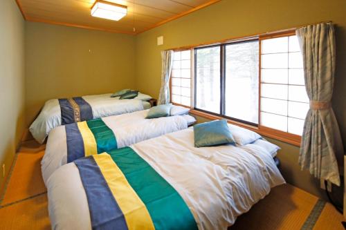 A bed or beds in a room at Abashiri - House - Vacation STAY 16445