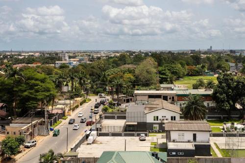 an aerial view of a city with cars on a street at Lagos Marriott Hotel Ikeja in Lagos