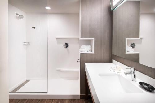 a bathroom with a sink and a shower at Courtyard by Marriott Pullman in Pullman