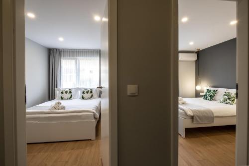 Cama ou camas em um quarto em The House-Kamenitza Апартамент и релакс зона