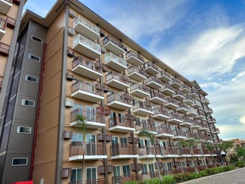an apartment building with balconies on the side of it at 2 BR Condo at Camella Manors Palawan in Puerto Princesa City