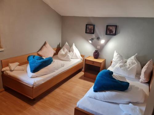 Posteľ alebo postele v izbe v ubytovaní Apartments Grillstube