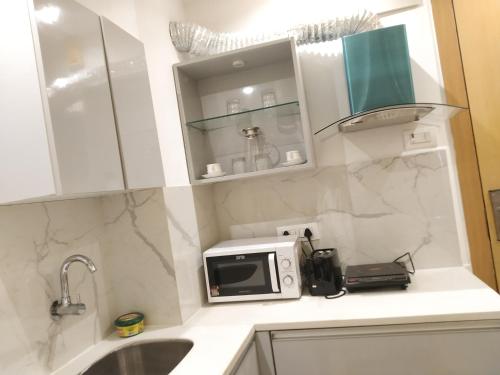 A kitchen or kitchenette at MoonLight Grand Anukampa