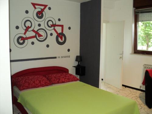 a bedroom with a bed with two bicycles on the wall at Rooms Sobe ZG in Zagreb