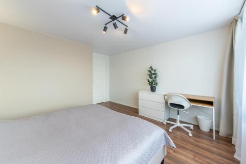 Postel nebo postele na pokoji v ubytování Stiklo Apartamentai