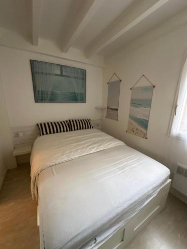 Ένα ή περισσότερα κρεβάτια σε δωμάτιο στο A 5 minutes des plages