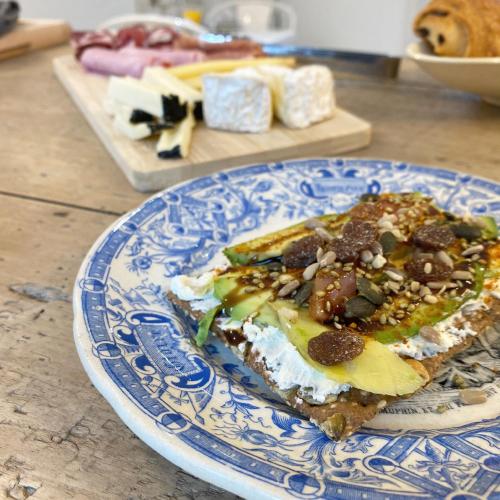 a blue and white plate with a piece of food at Maison Galop Marin in Saint-Côme-du-Mont