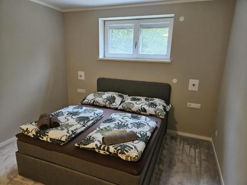 a small bed in a bedroom with a window at GardenLoft no1 in Vienna