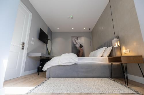 a bedroom with a large bed with at Vila Kace in Korçë