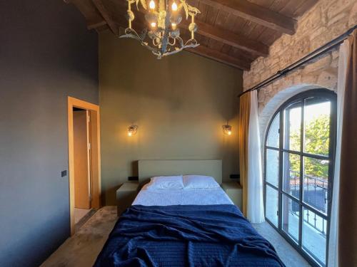 Postel nebo postele na pokoji v ubytování Rhea Alaçatı Boutique Hotel