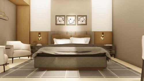 um quarto com uma cama grande e 2 cadeiras em Hotel Namah Courtyard em Khāpri