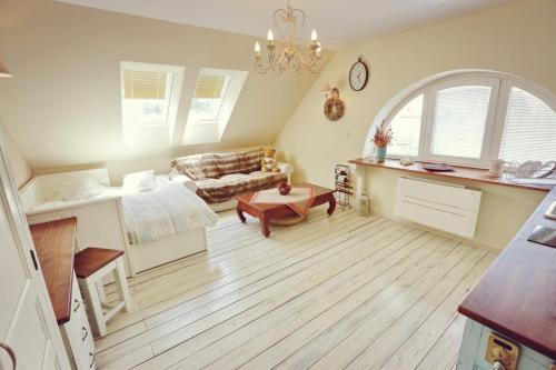 a living room with a couch and a table at Kalvín Restaurant & Pension in Rastislavice