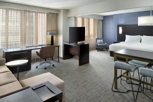 a hotel room with a bed and a desk at Residence Inn Bethesda Downtown in Bethesda