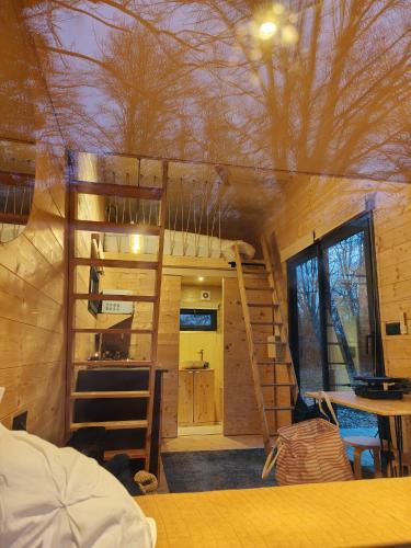 a room with a tree house with a bunk bed at Moose home Tiny house AMBUR in Saint-Jacques-dʼAmbur