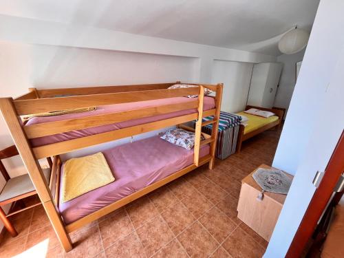 a room with two bunk beds in it at Apartments LIDO Petrovac in Petrovac na Moru