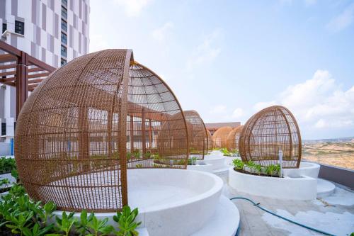 a group of bird cages sitting on top of a building at Bstudio in APEC Mandala Mũi Né in Phan Thiet