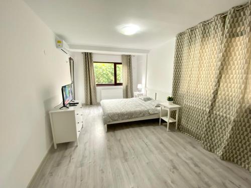 Postel nebo postele na pokoji v ubytování Morii Lake Apartaments & Studios
