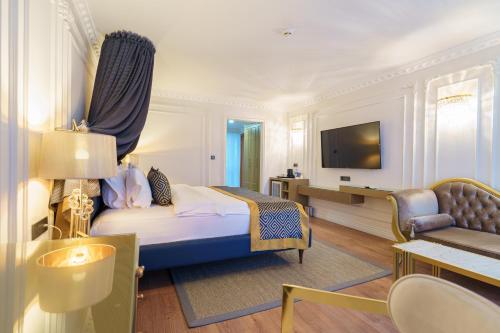 a hotel room with a bed and a television at La Quinta by Wyndham Giresun in Giresun