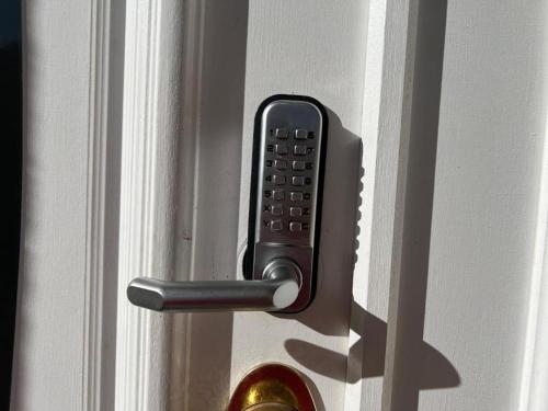 a remote control in a door handle on a door at Pleasant Private Room in Taylors Lake Near Melbourne Airport in Taylors Lakes