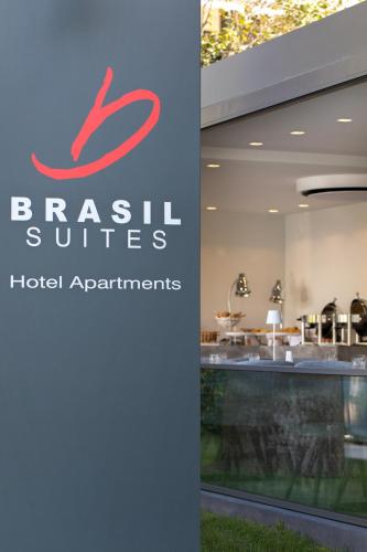 a sign for the brash suites hotel apartments at Brasil Suites Boutique Hotel in Athens