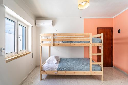 Postel nebo postele na pokoji v ubytování Sandy Bottoms Hostel