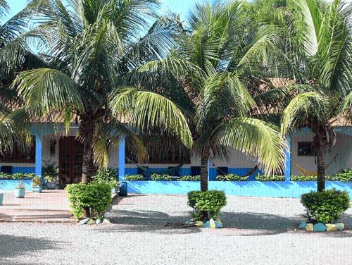 a resort with palm trees and a swimming pool at Hotel Lago Azul in Bonito