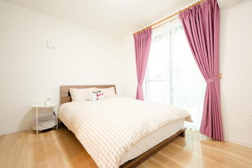 Postel nebo postele na pokoji v ubytování Tokyo Kitaku hotel