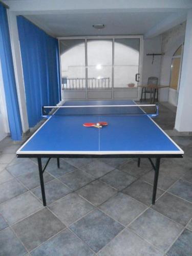 a blue ping pong table in a room at Studio & Apartments More in Neum