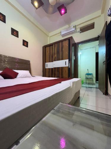 a hotel room with two beds and a glass floor at Dream Ashoka in Ujjain