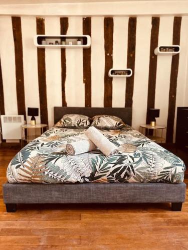 Säng eller sängar i ett rum på Cocon Bois-Joly