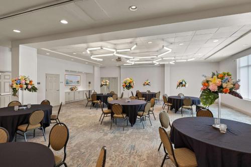 a banquet hall with tables and chairs and flowers at Hilton Garden Inn Atlanta East/Stonecrest in Lithonia