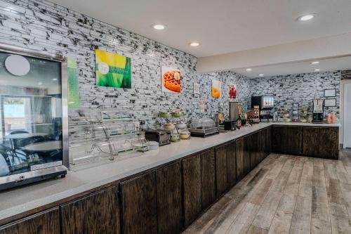 a fast food restaurant with a brick wall at Quality Inn Rockport on Aransas Bay in Rockport