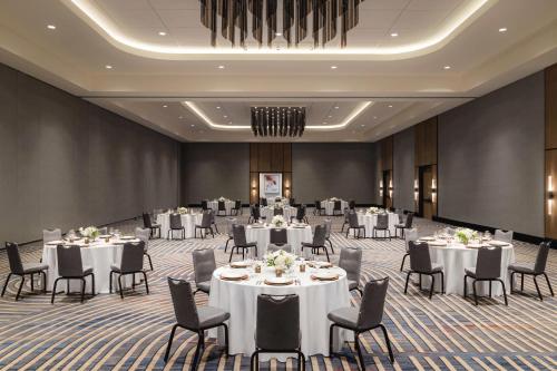 a ballroom with tables and chairs in a room at Doubletree By Hilton Abilene Downtown Convention Center in Abilene