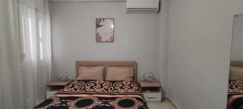 a bedroom with a bed with a skull blanket at Thes house in Thessaloniki