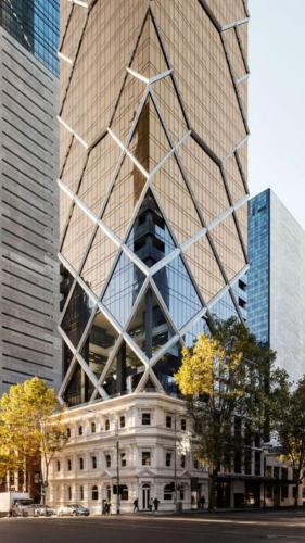 a large building with a triangle on the side of it at Paragon Apartment Penthouse Amazing Views, Spacious & Great Location in Melbourne