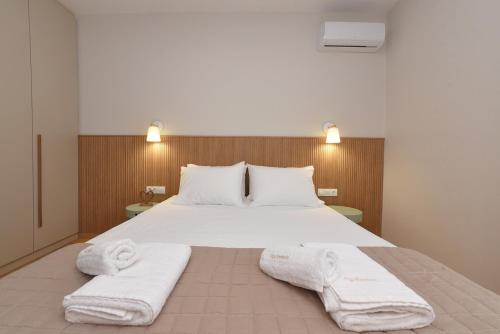 Postel nebo postele na pokoji v ubytování Cyclamen Apartments