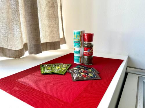 a red counter top with spices on a table at Luxury Urban Oasis Apartment in center Of Udine in Udine