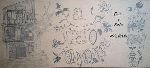 a drawing of a wall with a sign on it at EL VIEJO OLMO in Herguijuela de la Sierra