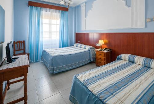 Posteľ alebo postele v izbe v ubytovaní Hotel Restaurante Los Molinos
