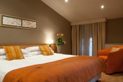 เตียงในห้องที่ Hotel Due Pini