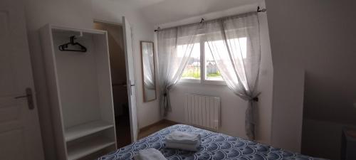 Postel nebo postele na pokoji v ubytování LE RANCON gite des Abbayes du Val de Seine