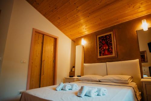 Una cama o camas en una habitación de Chalet B&B parcodellatimpa