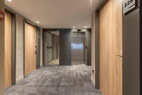 a corridor of an office building with a hallway at Astari in Tarragona
