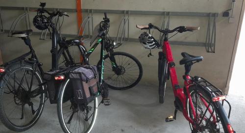 a group of bikes parked in a garage at Logis La Vieille Auberge, Art and Gallery in Souillac