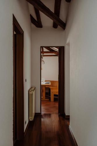 an empty room with a hallway with a desk in it at Artemar The Roof Piazza Unità in Trieste