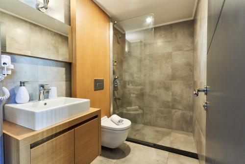 a bathroom with a sink and a toilet and a shower at Loft 1502 in Antalya