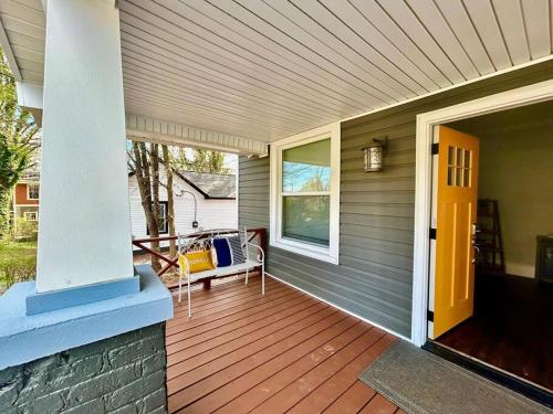 a porch of a house with a bench on it at Downtown Charm, 3 Bdr, Near Rest and Bars in Winston-Salem