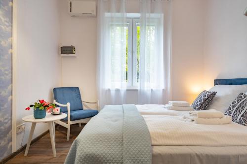 Кровать или кровати в номере Karkonosky Apartamenty - Majówka
